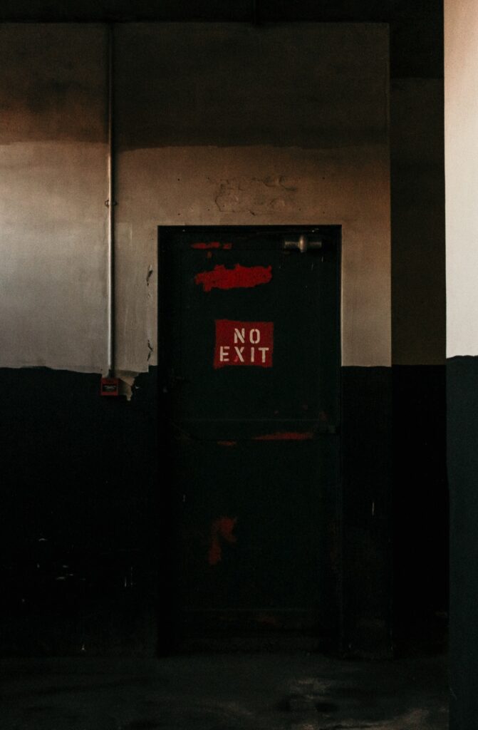 Creepy Room with a NO EXIT light - up sign.